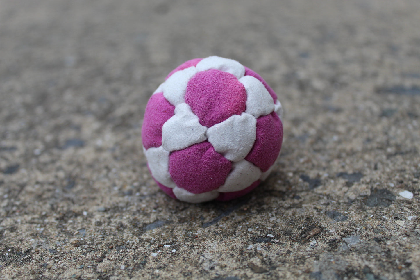 Xtremity Pro professional footbag with a 32 panel construction in Pink/White
