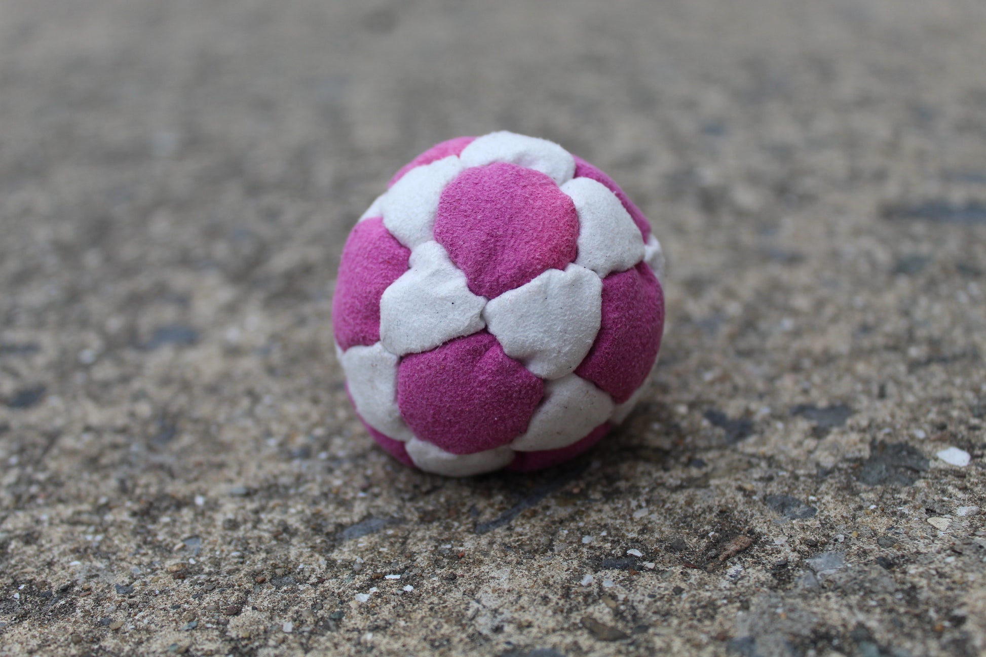 Xtremity Pro professional footbag with a 32 panel construction in Pink/White
