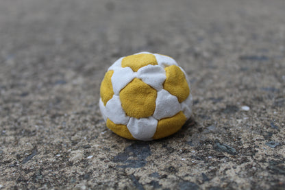 Xtremity Pro professional footbag with a 32 panel construction in Yellow/White