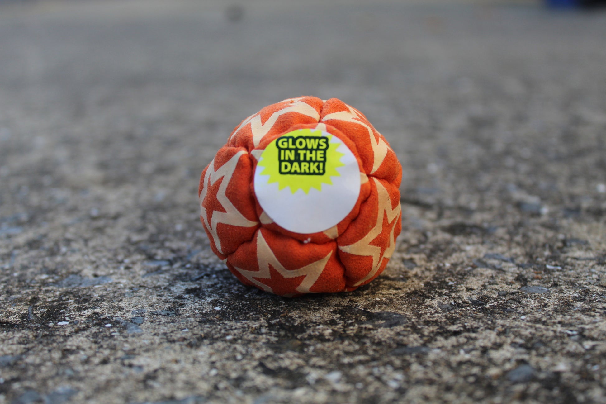 Static Glow footbag in orange with glow-in-the-dark synthetic suede panels
