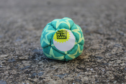 Static Glow footbag in green with glow-in-the-dark synthetic suede 