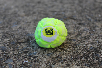 Static Glow footbag in bright yellow with glow-in-the-dark synthetic suede panels