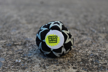 Static Glow footbag in blackwith glow-in-the-dark synthetic suede 